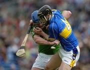 14 May 2006; Brian Begley, Limerick, is tackled by Paul Curran, Tipperary. Guinness Munster Senior Hurling Championship Quarter Final, Tipperary v Limerick, Semple Stadium, Thurles, Co. Tipperary. Picture credit; Ray McManus / SPORTSFILE