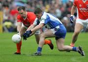 14 May 2006; Enda McNulty, Armagh, is tackled by Rory Woods, Monaghan. Bank of Ireland Ulster Senior Football Championship, Round 1, Armagh v Monaghan, St. Tighernach's Park, Clones, Co. Monaghan. Picture credit; Oliver McVeigh / SPORTSFILE
