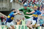 14 May 2006; Limerick's Brian Begley is tackled by Philip Maher, Tipperary, on his way to scoring his side's first goal. Guinness Munster Senior Hurling Championship Quarter Final, Tipperary v Limerick, Semple Stadium, Thurles, Co. Tipperary. Picture credit; David Levingstone / SPORTSFILE