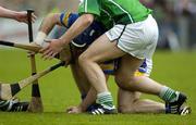14 May 2006; Eoin Kelly, Tipperary, is tackled by TJ Ryan and Mark Foley, Limerick. Guinness Munster Senior Hurling Championship Quarter Final, Tipperary v Limerick, Semple Stadium, Thurles, Co. Tipperary. Picture credit; Ray McManus / SPORTSFILE