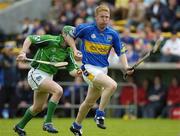 14 May 2006; Ger O'Grady, Tipperary, races clear of Seamus Hickey,  Limerick. Guinness Munster Senior Hurling Championship Quarter Final, Tipperary v Limerick, Semple Stadium, Thurles, Co. Tipperary. Picture credit; Ray McManus / SPORTSFILE