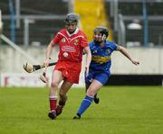 14 May 2006; Angela Walsh, Cork, is tackled by Trish O'Halloran, Tipperary. Camogie National League Division 1A Final, Cork v Tipperary, Semple Stadium, Thurles, Co. Tipperary. Picture credit; Ray McManus / SPORTSFILE