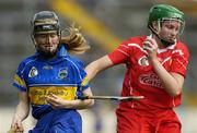 14 May 2006; Amanda O'Regan, Cork, is tackled by Joanne Ryan, Tipperary. Camogie National League Division 1A Final, Cork v Tipperary, Semple Stadium, Thurles, Co. Tipperary. Picture credit; Ray McManus / SPORTSFILE