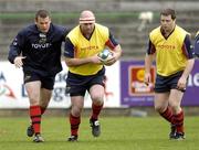 16 May 2006; John Hayes, centre, in action with his team-mates, Denis Fogarty, left, and Marcus Horan, during Munster squad training. Musgrave Park, Cork. Picture credit; David Maher / SPORTSFILE