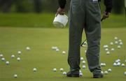16 May 2006; A caddy collects golf balls on the practice green. Nissan Irish Open Practice, Carton House Golf Club, Maynooth, Co. Kildare. Picture credit; Brian Lawless / SPORTSFILE