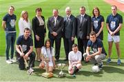 3 June 2014; At the launch of the Bus Éireann Féile final competitions are, back row, left to right, Leitrim ladies footballer Aine Tighe, Marie Hickey, Uachtarán Tofa of the LGFA, President of the Camogie Association Aileen Lawlor, Uachtarán Chumann Lúthchleas Gael Liam Ó Néill, GAA Handball President, Willie Roche, Martin Nolan, Chief Executive Officer, Bus Éireann, Down camogie player Fionnaula Carr and Ulster senior handballer Charlie Shanks. Front row, left to right, Derry hurler Kevin Henphy, Holy Trinity School, Donaghmede, pupils Jasmine Kamtoh and Paddy Bridgeman, both aged 11, and Galway footballer Paul Conroy. The two Féile final competitions will involve more than 4,000 boys and girls across the disciplines of Football, Hurling, Camogie, Ladies Football, and Handball as clubs from all over Ireland and a number of overseas units come together to compete for what are the GAA’s youngest national titles. Croke Park, Dublin. Picture credit: Ramsey Cardy / SPORTSFILE