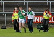1 June 2014; John Woods, Fermanagh leaves the pitch with a broken jaw early in the game. Ulster GAA Football Senior Championship, Quarter-Final, Fermanagh v Antrim, Brewster Park, Enniskillen, Co. Fermanagh. Picture credit: Oliver McVeigh / SPORTSFILE