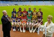 16 May 2006; Gala, Ireland's fastest growing retailer, has been announced as the first commercial sponsor of the All-Ireland Senior Camogie Championship. Pictured testing his skills is Tom Keogh, CEO, Gala, watched by Liz Howard, President, Cumann Camogaiochta na nGael and players, fromt from left, Philly Fogarty, Tipperary, Kate Kelly, Wexford, Joanne O'Callaghan, Cork, Michelle Casey, Limerick, Jillian Dillon Maher, Kilkenny and Caroline Murray, Galway with back, from left, Eimear Ryan, Tipperary, Margaret D'Arcy, Wexford, Mary O'Connor, Cork, Moira Dooley, Limerick, Lucinda Gahan, Kilkenny and Deirdre Burke, Galway. Croke Park, Dublin. Picture credit; Brendan Moran / SPORTSFILE
