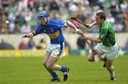 14 May 2006; John O'Brien, Tipperary, is tackled by Ollie Moran, Limerick. Guinness Munster Senior Hurling Championship Quarter Final, Tipperary v Limerick, Semple Stadium, Thurles, Co. Tipperary. Picture credit; Ray McManus / SPORTSFILE