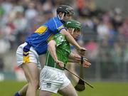 14 May 2006; Andrew O'Shaughnessy, Limerick, is tackled by Philip Maher, Tipperary. Guinness Munster Senior Hurling Championship Quarter Final, Tipperary v Limerick, Semple Stadium, Thurles, Co. Tipperary. Picture credit; Ray McManus / SPORTSFILE