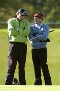 18 May 2006; Ian Poulter, England, left, and Paul McGinley, Ireland, chat on the 14th green while awaiting while Kenneth Ferrie, England, putts during the first round. Nissan Irish Open Golf Championship, Carton House Golf Club, Maynooth, Co. Kildare. Picture credit; Brendan Moran / SPORTSFILE