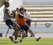 20 May 2006; Andy Reid, Republic of Ireland, in action against his team-mate Steven Reid, during squad training. Municipal Stadium, Lagos, Portugal. Picture credit; David Maher / SPORTSFILE