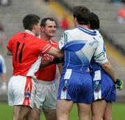 20 May 2006; Steven Mc Donnell, Armagh, is held by Gary McQuaid, Monaghan, as Brian Mallon steps in. Bank of Ireland Ulster Senior Football Championship Replay, Round 1, Armagh v Monaghan, St. Tighernach's Park, Clones, Co. Monaghan. Picture credit; Oliver McVeigh / SPORTSFILE