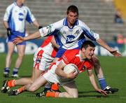 20 May 2006; Andy Mallon, Armagh, is tackled by Thomas Freeman, Monaghan. Bank of Ireland Ulster Senior Football Championship Replay, Round 1, Armagh v Monaghan, St. Tighernach's Park, Clones, Co. Monaghan. Picture credit; Oliver McVeigh / SPORTSFILE