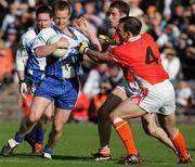 20 May 2006; Enda McNulty and Paul McGrane, Armagh, is tackled by Dermot McArdle, Monaghan. Bank of Ireland Ulster Senior Football Championship Replay, Round 1, Armagh v Monaghan, St. Tighernach's Park, Clones, Co. Monaghan. Picture credit; Oliver McVeigh / SPORTSFILE