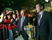 20 May 2006; Munster coach Declan Kidney and captain Anthony Foley arrive at Shannon Airport with the Heineken Cup after the Heineken Cup Final in Cardiff. Picture credit; Kieran Clancy / SPORTSFILE
