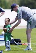 21 May 2006; Republic of Ireland manager Steve Staunton moves four year old Cormac Fagan off the playing pitch during squad training. Municipal Stadium, Lagos, Portugal. Picture credit; David Maher / SPORTSFILE