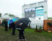 21 May 2006; Spectators watch replays on the big screen after play was suspended due to poor weather conditions. Nissan Irish Open Golf Championship. Carton House Golf Club, Maynooth, Co. Kildare. Picture credit; David Levingstone / SPORTSFILE
