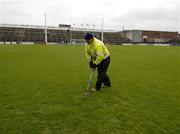 21 May 2006; Groundsman James Flaherty uses a fork to try and relace some of the surface water on the pitch. The minor game was played to half-time but it and the senior game were postponed after an inspection. Bank of Ireland Connacht Senior Football Championship, Quarter-final, Galway v Sligo, Pearse Stadium, Galway. Picture credit; Ray McManus / SPORTSFILE