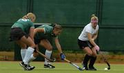 21 May 2006; Jane Chapple, Cork Harlequins, in action against Katie Saunderson, left, and Clare Parkhill, Randalstown. The Women's 2006 ESB Club Championships, Cork Harlequins v Randalstown, National Hockey Stadium, UCD, Belfield, Dublin. Picture credit: Ciara Lyster / SPORTSFILE