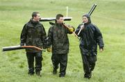 21 May 2006; Green keepers leave the course after it was announced that play would be suspended until tomorrow. Nissan Irish Open Golf Championship. Carton House Golf Club, Maynooth, Co. Kildare. Picture credit; Brian Lawless / SPORTSFILE