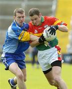 21 May 2006; Patrick Hickey, Carlow, is tackled by Kevin Manning, Wicklow. Bank of Ireland Leinster Senior Football Championship, Round 1, Wicklow v Carlow, Wexford Park, Co. Wexford. Picture credit; Matt Browne / SPORTSFILE