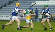 21 May 2006; Brian Carroll, Offaly, in action against Cahir Healy, left, and James Hyland, Laois. Guinness Leinster Senior Hurling Championship, Quarter-final, Laois v Offaly, O'Moore Park, Portlaoise, Co. Laois. Picture credit; Brendan Moran / SPORTSFILE