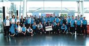 5 June 2014; The Eastern Region men's Basketball teams with Irish rugby captain Fiona Coughlan during the launch of Team Eastern Region for the Special Olympics Ireland Summer Games. Terminal Two, Dublin Airport, Dublin. Picture credit: Brendan Moran / SPORTSFILE