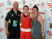 7 June 2014; Ireland's Katie Taylor with her parents, Pete Taylor, trainer, and mother Bridget after victory over Estelle Mossley, France, in their 60kg Final bout to win her sixth straight european title. 2014 European Women’s Boxing Championships Finals, Polivalenta Hall, Bucharest, Romania. Picture credit: Pat Murphy / SPORTSFILE
