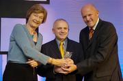20 May 2006; Ger Tarrant, Ireland coach, who was presented with the Senior Women's International award by Tony Colgan, President of Basketball Ireland, right, and Sheila Gillick. Basketball Ireland Awards, Conrad Hotel, Dublin. Picture credit; Pat Murphy / SPORTSFILE