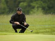 20 May 2006; Michael Hoey, Ireland, lines up a putt on the 16th green during round 2. Nissan Irish Open Golf Championship, Carton House Golf Club, Maynooth, Co. Kildare. Picture credit; Pat Murphy / SPORTSFILE