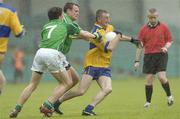 21 May 2006; David Russell, Clare, is tackled by Jason Stokes and Andrew Lane, Limerick. Bank of Ireland Munster Senior Football Championship, Quarter-final, Limerick v Clare, Gaelic Grounds, Limerick. Picture credit; Damien Eagers / SPORTSFILE