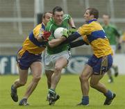 21 May 2006; Michael Crowley, Limerick, is tackled by Dara Blake, right, Clare. Bank of Ireland Munster Senior Football Championship, Quarter-final, Limerick v Clare, Gaelic Grounds, Limerick. Picture credit; Damien Eagers / SPORTSFILE
