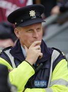 14 May 2006; Dublin manager Paul Caffrey, who was on duty as a Garda, watches the match. Bank of Ireland Leinster Senior Football Championship, Round 1, Westmeath v Offaly, Croke Park, Dublin. Picture credit; Brian Lawless / SPORTSFILE