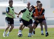 23 May 2006; Andy Reid, centre, Republic of Ireland, in action against his team-mates Robbie Keane and Richard Dunne, during squad training. Municipal Stadium, Lagos, Portugal. Picture credit; David Maher / SPORTSFILE