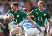 7 June 2014; Darren Cave, Ireland, is tackled by Joaquin Tuculet, Argentina. Summer Tour 2014, First Test, Argentina v Ireland. Estadio Centenario, Resistencia, Chaco, Argentina. Picture credit: Stephen McCarthy / SPORTSFILE