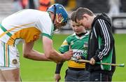 7 June 2014; Offaly supporters Peter and Fergal Naughton have their hurley signed by goalkeeper James Dempsey. Leinster GAA Hurling Senior Championship, Quarter-Final, Kilkenny v Offaly, Nowlan Park, Kilkenny. Picture credit: Ray McManus / SPORTSFILE
