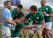 7 June 2014; Jonathan Sexton, Ireland, is congratulated by team-mates, from left, Felix Jones, Iain Henderson and Simon Zebo after scoring his side's second try. Summer Tour 2014, First Test, Argentina v Ireland. Estadio Centenario, Resistencia, Chaco, Argentina. Picture credit: Stephen McCarthy / SPORTSFILE