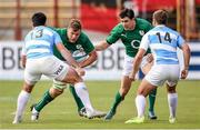 7 June 2014; Jordi Murphy, with support from his Ireland team-mate Felix Jones, in action against Jerónimo De la Fuente, left, and Santiago Cordero, Argentina. Summer Tour 2014, First Test, Argentina v Ireland. Estadio Centenario, Resistencia, Chaco, Argentina. Picture credit: Stephen McCarthy / SPORTSFILE