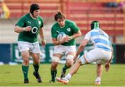 7 June 2014; Iain Henderson, Ireland, with the support of his team-mate Mike Ross, in action against Benjamin Macome, Argentina. Summer Tour 2014, First Test, Argentina v Ireland. Estadio Centenario, Resistencia, Chaco, Argentina. Picture credit: Stephen McCarthy / SPORTSFILE