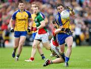 8 June 2014; Ciaráin Murtagh, Roscommon, is tackled by Diarmuid O'Connor, Mayo. Connacht GAA Football Senior Championship, Semi-Final, Roscommon v Mayo, Dr. Hyde Park, Roscommon. Picture credit: Barry Cregg / SPORTSFILE