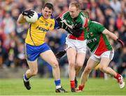 8 June 2014; Diarmuid Murtagh, Roscommon, in action against Tom Cunniffe and Colm Boyle, right, Mayo. Connacht GAA Football Senior Championship, Semi-Final, Roscommon v Mayo, Dr. Hyde Park, Roscommon. Picture credit: Matt Browne / SPORTSFILE
