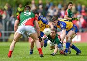 8 June 2014; Keith Higgins, Mayo, passes the ball to team-mate Séamus O'Shea as he is tackled by Ciaráin Cafferkey, left, and Cathal Cregg, Roscommon. Connacht GAA Football Senior Championship, Semi-Final, Roscommon v Mayo, Dr. Hyde Park, Roscommon. Picture credit: Barry Cregg / SPORTSFILE