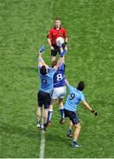 8 June 2014; Referee Pádraig Hughes throws the ball in at the start of the game between Kevin Meaney, Laois, and Michael Darragh MacAuley, left, and Cian O'Sullivan, Dublin. Leinster GAA Football Senior Championship, Quarter-Final, Dublin v Laois, Croke Park, Dublin. Picture credit: Dáire Brennan / SPORTSFILE