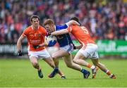 8 June 2014; Niall McDermott, Cavan, in action against Mark Shields, Armagh. Ulster GAA Football Senior Championship, Quarter-Final, Armagh v Cavan, Athletic Grounds, Armagh. Picture credit: Ramsey Cardy / SPORTSFILE