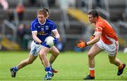 8 June 2014; Jack Brady, Cavan, in action against Brendan Donaghy, Armagh. Ulster GAA Football Senior Championship, Quarter-Final, Armagh v Cavan, Athletic Grounds, Armagh. Picture credit: Ramsey Cardy / SPORTSFILE