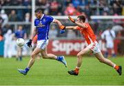 8 June 2014; David Givney, Cavan, in action against Brendan Donaghy, Armagh. Ulster GAA Football Senior Championship, Quarter-Final, Armagh v Cavan, Athletic Grounds, Armagh. Picture credit: Ramsey Cardy / SPORTSFILE
