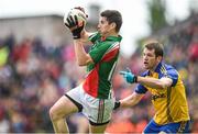 8 June 2014; Alan Freeman, Mayo, in action against Niall Carty, Roscommon. Connacht GAA Football Senior Championship, Semi-Final, Roscommon v Mayo, Dr. Hyde Park, Roscommon. Picture credit: Matt Browne / SPORTSFILE