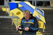 8 June 2014; Roscommon supporter Charlie McDonald looks up his programme before the game. Connacht GAA Football Senior Championship, Semi-Final, Roscommon v Mayo, Dr. Hyde Park, Roscommon. Picture credit: Barry Cregg / SPORTSFILE