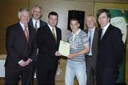 22 May 2006; Brian Lenihan T.D., Minister of State at the Department of Health and Children, 3rd from left, assisted by, from left, Vincent Butler, FAI, Martin Quilty, FETAC, Harry McCue, FAI and John Delaney, CEO of the Football Association of Ireland, presents a certificate to Kenneth Mahoney, one of to 24 graduates of the 2005 FÁS/FAI Training Programme. John Paul Park, Cabra, Dublin. Picture credit: Damien Eagers / SPORTSFILE